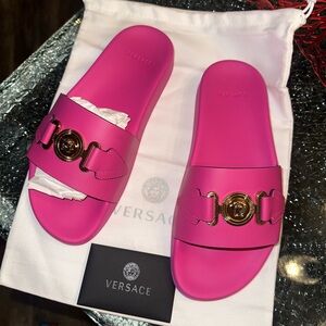 Brand new Versace women’s pink slides.